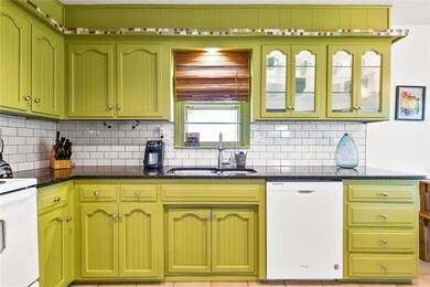 Love the white subway tile backsplash!