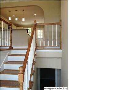 MAIN ENTRANCE WITH HARDWOOD STEPS THAT LEAD YOU TO