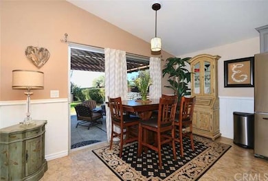 Dining area with Sliding Door to Backyard and Pati