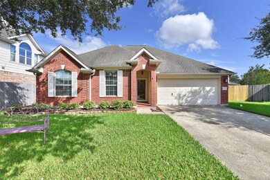 Grand elevation with a double wide driveway ~