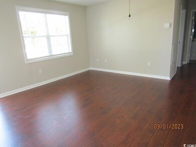 Spare room featuring dark hardwood / wood-style floors