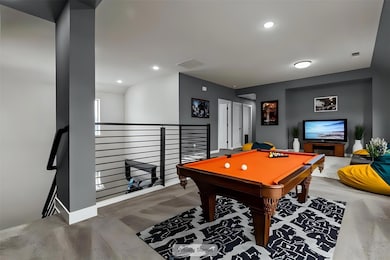 Game room featuring wood finished floors, pool ta