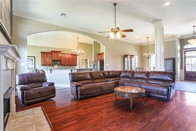 Open floor plan with beautiful lighting fixtures.