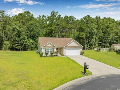 View of front of property with an attached garage and concrete driveway