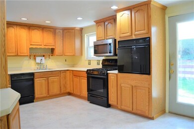 Newly remodeled, eat in kitchen featuring oak cabi
