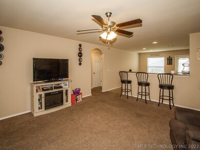 Spacious living open to kitchen, breakfast bar and