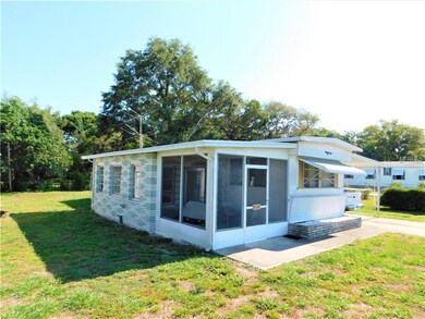 Side of home with Screen patio and Florida room.