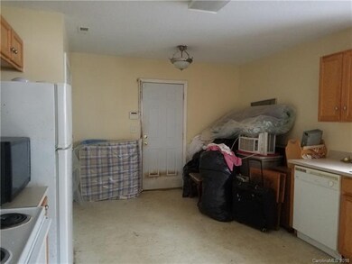 Kitchen still has trash to be removed by buyers. A