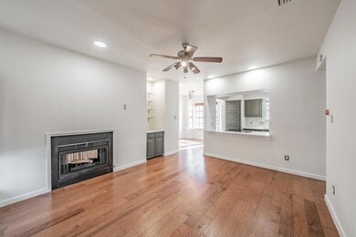 Unfurnished living room featuring a multi sided fi