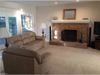 Family room with fireplace and doors to deck