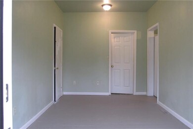 09' x 15' entry room, on left is door to carport, 