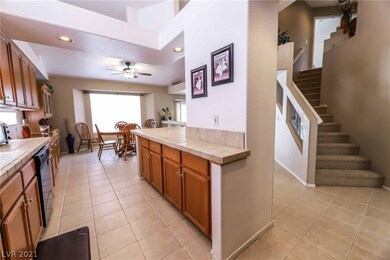 Gourmet kitchen features extended cabinets, tile,
