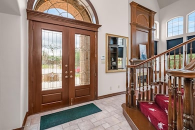Double French Doors grace entryway giving plenty of natural light