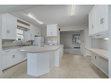 The kitchen features a breakfast bar.