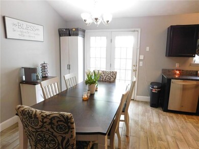 Dining area with light wood-type flooring, baseboa