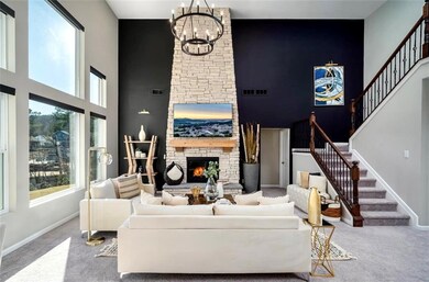 Living room featuring visible vents, a fireplace, 