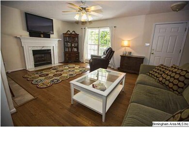 Living Room with hardwood floors and marble firepl