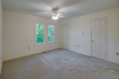 Primary bedroom #1 has new carpet, ceiling fan wit