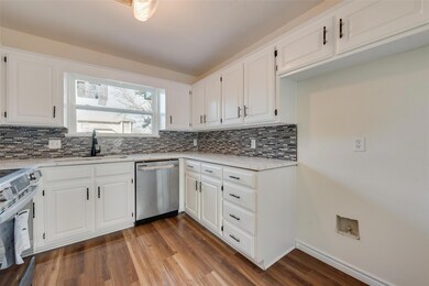 Kitchen with stainless steel appliances, wood-type