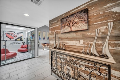 Hall featuring wooden walls and recessed lighting