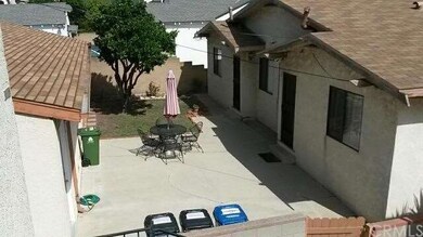 Backyard in between duplex & garages