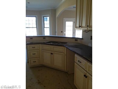 Kitchen. Granite tops w/hardwood floors
