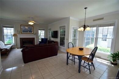 Open floor plan features the kitchen open to a lar