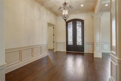 Front entrance doors are constructed of iron and g