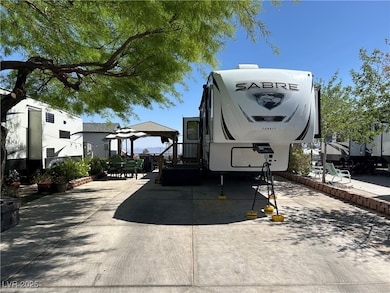 View of property with a gazebo and a patio area