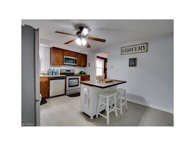 kitchen with maple cabinets, new flooring and stai