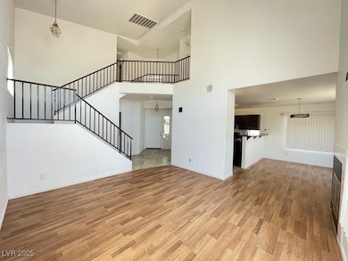 Unfurnished living room with light wood-style floo