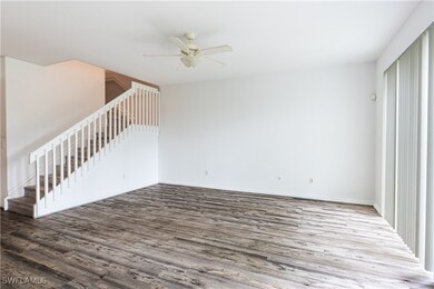 Unfurnished living room with wood finished floors