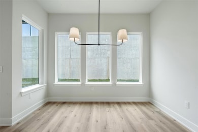 Unfurnished dining area with a chandelier, wood f
