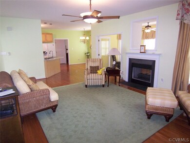 Family room with hardwood floors and pass through