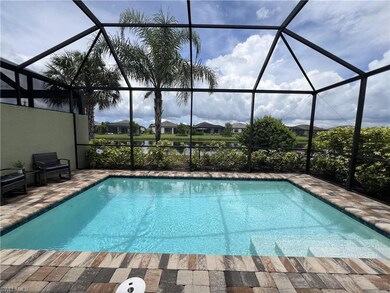 View of pool with a lanai