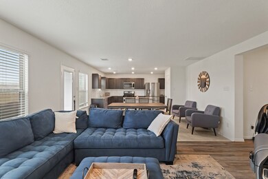 Living room features beautiful flooring and large