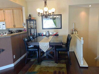 Dining area with new chandelier and laminate floor