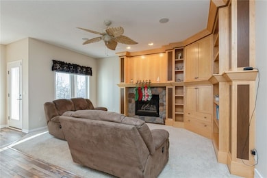 Family room with custom built-in. TV is behind doo