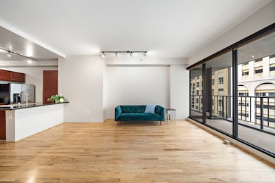 Track lighting illuminates the walls throughout th