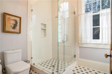 First floor full bathroom w/ glass enclosed shower