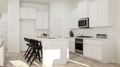 Kitchen with sink, stainless steel appliances, a k
