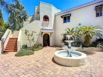A fountain enhances the ambiance of the brick paved courtyard.