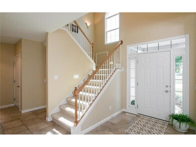 Two Story Foyer with Tiled Floors