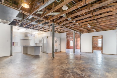 Basement featuring stainless steel fridge