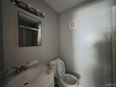 Full bathroom with a stall shower and vanity