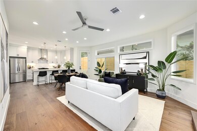 Living area with recessed lighting, ceiling fan, 