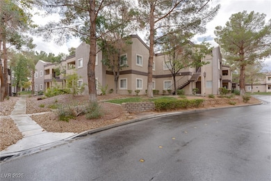 View of front of house with stairway, a residential view, and stucco siding