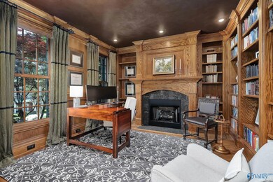 Equally cozy and opulent, the study offers solid wood built-ins and a fireplace. The perfect place to read for pleasure or work from home.