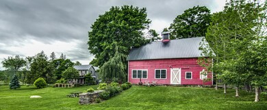 view of back of barn and house
