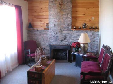 Other Cozy den with wood-burning fireplace